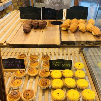 Teamania - Some of the baked items on display. Cheese tart $2.45 ; Coconut Tart $2.75 Madeleines Chocolate/Vanilla $1.20 each - Bakeries Near Me - Rockville, Maryland Teamania - Some of the baked items on display. Cheese tart $2.45 ; Coconut Tart $2.75 Madeleines Chocolate/Vanilla $1.20 each - Bakeries Near Me - Rockville, Maryland