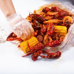 Captain's Seafood Boil - Crawfish, shrimp, corn, and sausage boil mix doused in Captain's Mix sauce