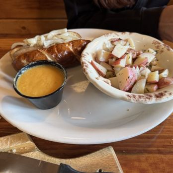 Bryce Canyon Pines Restaurant - Daily Special - Brat on a Pretzel Bun and Potato Salad, with beer cheese sauce - American Near Me - Bryce Canyon, Utah