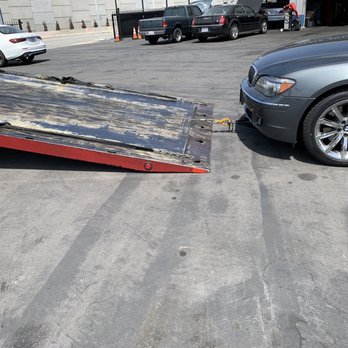 Technique Towing - Car being towed to the shop. - Towing Near Me