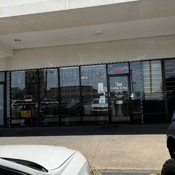 Njoi - a car parked in front of a store - Coffee & Tea Near Me - Houston, Texas