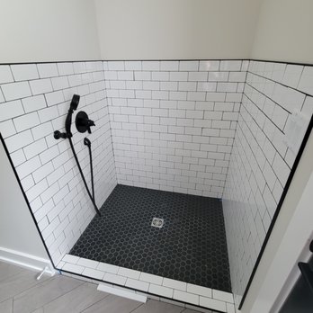 Wenke Flooring & Design - a black and white tiled shower - Carpeting Near Me - Schoolcraft, Michigan Wenke Flooring & Design - a black and white tiled shower - Carpeting Near Me - Schoolcraft, Michigan