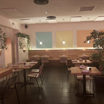Deer + Almond - a dining area with tables and chairs - Tapas Bars Near Me - Winnipeg, Manitoba