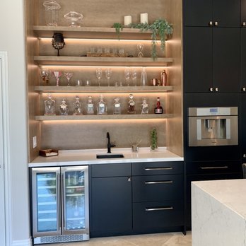 Classic Kitchens - a modern kitchen with black cabinets - Flooring Near Me - Ontario, California