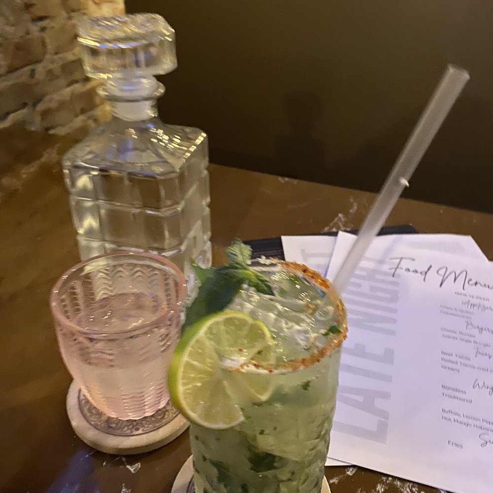 Barrio Eats & Drinks - Titos cucumber mojito, mint leafs and sliced cucumber. The water and loved the pink"ish" glass, did not taste like tap water either ‍ - Mexican Near Me - El Paso, Texas
