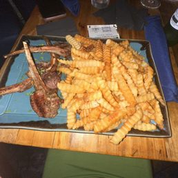 Lamb chops and double side of fries Lamb chops and double side of fries