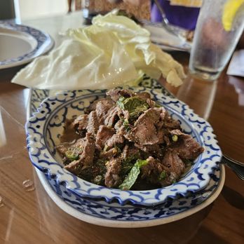 Thai Kitchen - NEAU NAM TOK [GL] Grilled marinated thinly-sliced steak. Seasoned with mint leaves, scallion, hot peppers, and fresh lime juice. - Thai Near Me - Baton Rouge, Louisiana