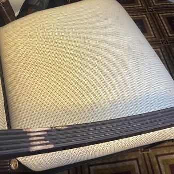The Embassy Hotel - Dingy stained and scuffed chair. - Hotels Near Me - San Francisco, California The Embassy Hotel - Dingy stained and scuffed chair. - Hotels Near Me - San Francisco, California