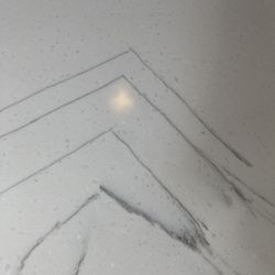 Lien Research - a seam created these 90 degree angles and Topline did not disclose that they placed a seam. Definitely does not look natural.