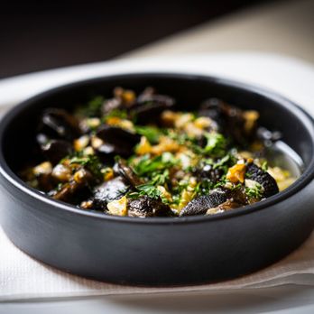 Chez Delmo - a bowl of food on a plate - Seafood Near Me - Montreal, Quebec Chez Delmo - a bowl of food on a plate - Seafood Near Me - Montreal, Quebec
