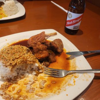 The Well Jamaican Restaurant - Brown stewed chicken and white rice. - Seafood Near Me - Randolph, Massachusetts