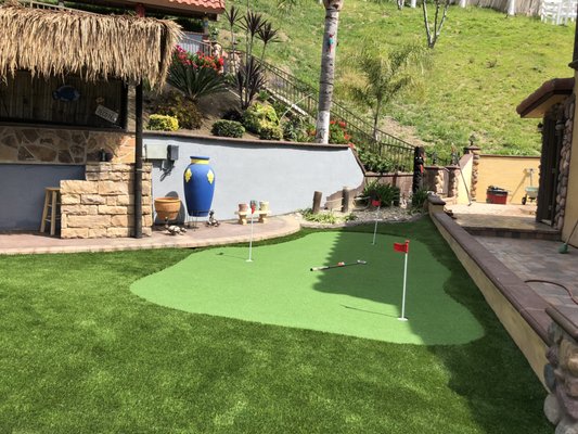 Putting Green 2025 - We recently completed a custom backyard putting green designed for both performance and visual appeal. This install features high-quality synthetic turf that mimics the roll and speed of a natural green, providing a true golf experience without the maintenance. Putting Green 2025 - We recently completed a custom backyard putting green designed for both performance and visual appeal. This install features high-quality synthetic turf that mimics the roll and speed of a natural green, providing a true golf experience without the maintenance.