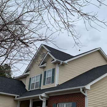 Iron Sharp Precision Contracting - a house with a clock tower - Roofing Near Me - Charlotte, North Carolina Iron Sharp Precision Contracting - a house with a clock tower - Roofing Near Me - Charlotte, North Carolina