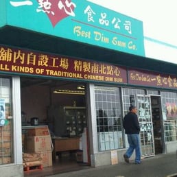 a man walking in front of a store a man walking in front of a store