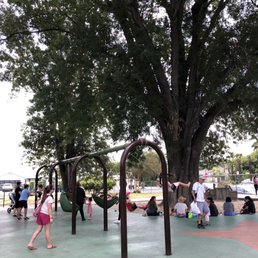 The swing set below one of the large trees