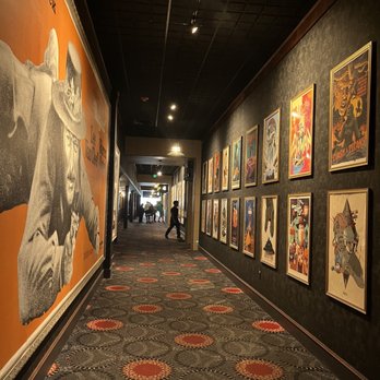 Alamo Drafthouse Cinema Mueller - a hallway with posters - Cinema Near Me - Austin, Texas