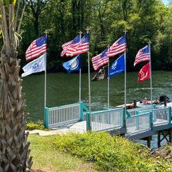 Toucan’s Lakefront Restaurant - Military service flags on full display near dock slips