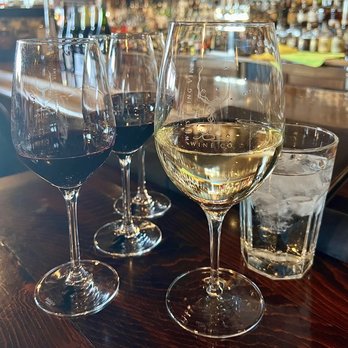 Whispering Vine - Left: Flight of red wine. Right: 8 oz glass of sauvignon blanc. - Wine Bars Near Me - Reno, Nevada