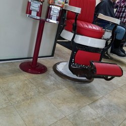 The Polar Bear Den Barber Shop - An old barber chair