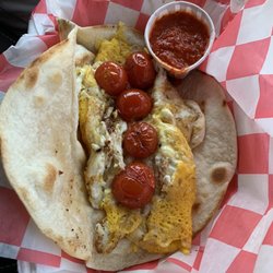 Cracked - Boursin cheese omelette on tortilla with fresh tomatoes