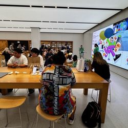 Apple Brea Mall - Back video wall and the setup/genius bar tables.