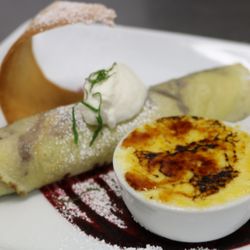 The New Tunnel Supper Club - Cerises Jubilee Crepe Cherries Jubilee Crepe - Vanilla Creme Brûlée Ice Cream - Huckleberry Glaze - Tuile - Mint Chiffonade