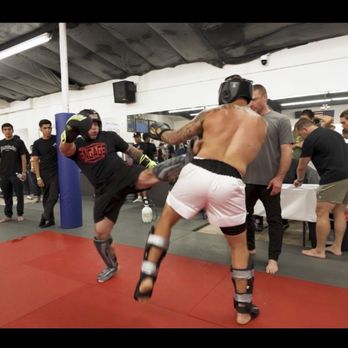 Engage Combat Training - Coach Richard landing the kick - Muay Thai Near Me - Redlands, California Engage Combat Training - Coach Richard landing the kick - Muay Thai Near Me - Redlands, California