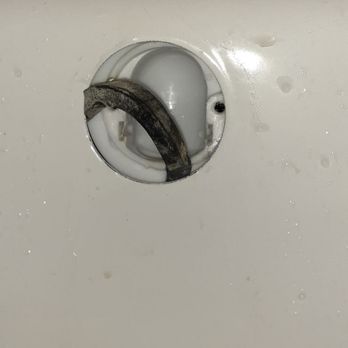 J&T Remodeling - This is the overflow drain on a new tub where the foam washer was installed half-assed, water leaked and damaged the wall behind. - General Contractors Near Me - Everett, Washington J&T Remodeling - This is the overflow drain on a new tub where the foam washer was installed half-assed, water leaked and damaged the wall behind. - General Contractors Near Me - Everett, Washington