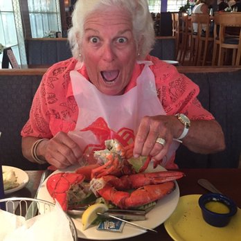 Juno Beach Fish House - Mom eating lobster - Seafood Near Me - Juno Beach, Florida Juno Beach Fish House - Mom eating lobster - Seafood Near Me - Juno Beach, Florida