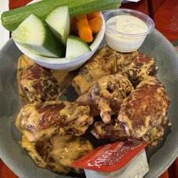 St. Louis Bar & Grill - Buffalo Ranch wings with a side of veggies, and garlic dill sauce in the bottom