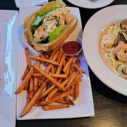 Left to right: baked oysters, lobster roll with sweet potato fries, seafood deluxe linguine with twist sauce