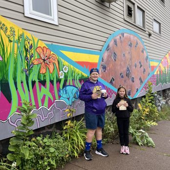 Positively 3rd Street Bakery - Kids with their goodies in front of the bakery mural. - Bakeries Near Me - Duluth, Minnesota