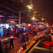Photo of Bowlero North Scottsdale - Phoenix, AZ, United States. Vast area behind the bowling area which includes video arcade, service, kitchen, bar, restrooms, and more