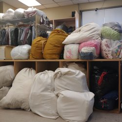 Laundrolounge - The attendant is behind this pile, while self serve customers are on this side...weird!