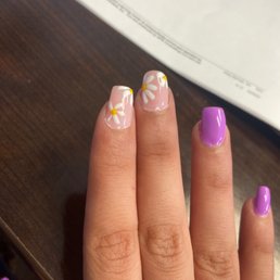 Day 1 already seems weird at bottom of index / middle finger especially. Not coffin shape. A lady did flower design, I loved it