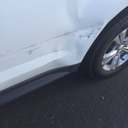 Passenger side door had a dent and chipped paint. Passenger side door had a dent and chipped paint.