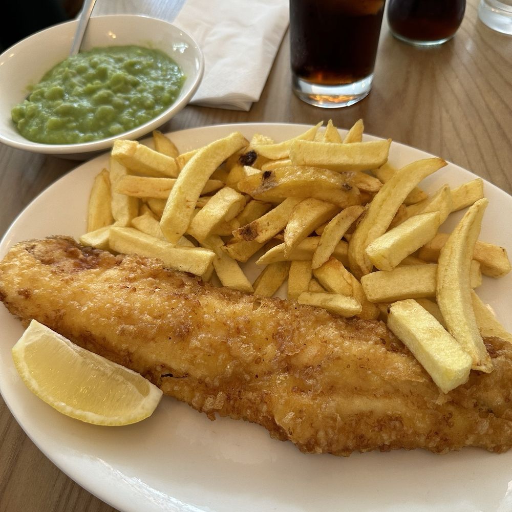 Small fried haddock, small chips, and mushy peas.  Yum.