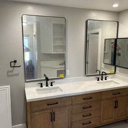 ER Construction & Remodeling - New vanity and mirrors.