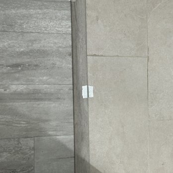 JNA Builds - Literally taped the floor transition with duct tape - General Contractors Near Me JNA Builds - Literally taped the floor transition with duct tape - General Contractors Near Me