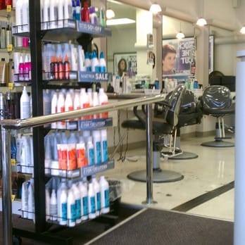 Supercuts - Racks of hair care products and some of the cutting stations are visible on the left as you enter the store. - Hair Salons Near Me - Charlotte, North Carolina Supercuts - Racks of hair care products and some of the cutting stations are visible on the left as you enter the store. - Hair Salons Near Me - Charlotte, North Carolina