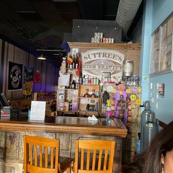 Suttree's High Gravity Tavern - a woman sitting at the bar - Ramen Near Me - Knoxville, Tennessee