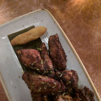 Chubby's Jamaican Kitchen - Slow baked jerk wings (that little kick to it, finger licking goooooood) also came with these tasty breading fillers. - Caribbean Near Me - Toronto, Ontario