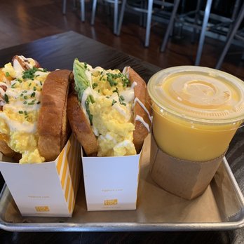 Egg Tuck - Bacon and Cheese Sandwich (left), Avocado Egg Sandwich (middle), and orange juice (right) - Breakfast & Brunch Near Me - Los Angeles, California Egg Tuck - Bacon and Cheese Sandwich (left), Avocado Egg Sandwich (middle), and orange juice (right) - Breakfast & Brunch Near Me - Los Angeles, California