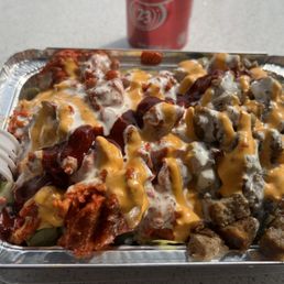 a tray of food with meat and cheese