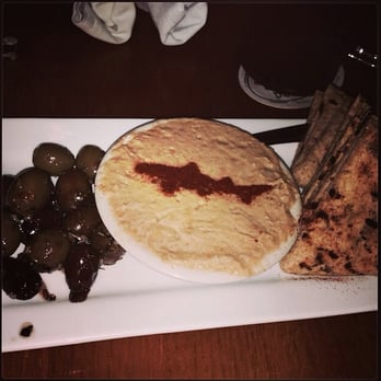 Dogfish Head Brewings & Eats - The hummus plate recently changed from celery & carrots to olives (served with warm pita). A smaller serving but still delicious - American Near Me - Rehoboth Beach, Delaware