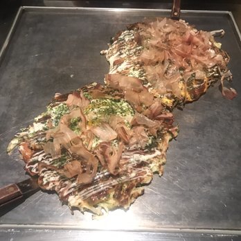 Gaijin - Osaka octopus okonomiyaki with egg (front) and Hiroshima  traditional okonomiyaki (back) - Japanese Near Me - Chicago, Illinois