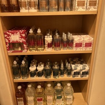 Williams-Sonoma - a shelf full of bottles and soaps - Kitchen & Bath Near Me - Albuquerque, New Mexico