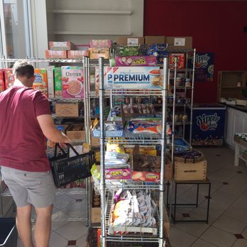 Daily Needs - a man shopping in a grocery store - Grocery Near Me - Pasadena, California