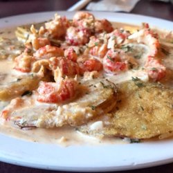 Tony's Family Restaurant & Ice Cream Parlor - Fried green tomatoes topped with crawfish. Follow my food adventures on IG: @saltnsucar