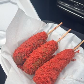 Cutting board CLT - Korean corn dog with half meat and half cheese covered with hot Cheetos - Food Trucks Near Me - Charlotte, North Carolina Cutting board CLT - Korean corn dog with half meat and half cheese covered with hot Cheetos - Food Trucks Near Me - Charlotte, North Carolina